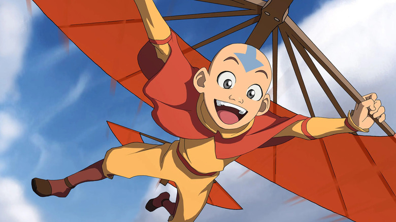 Aang melonjak dengan glider airbending di Avatar: The Last Airbender