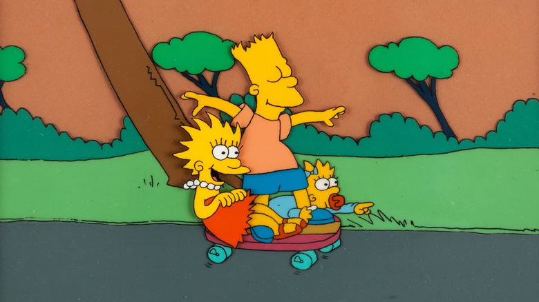 Lisa, Bart, dan Maggie Simpson mengendarai skateboard di acara Tracey Ullman