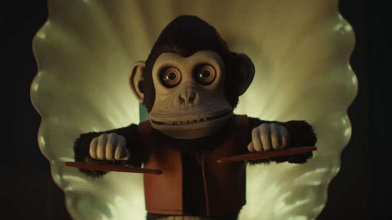 The Monkey Toy Hening Up the Drumsticks In The Monkey (2025)