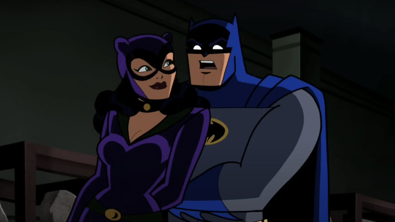 Batman terlihat terkejut ketika dia berdiri di belakang Catwoman di Batman the Brave and the Bold