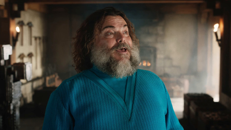 Jack Black as Steve di ruangan yang penuh dengan alat dalam film Minecraft