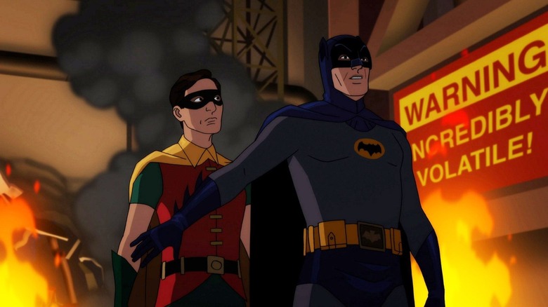 Robin dan Batman di pabrik yang meledak di Batman vs Tw. Face